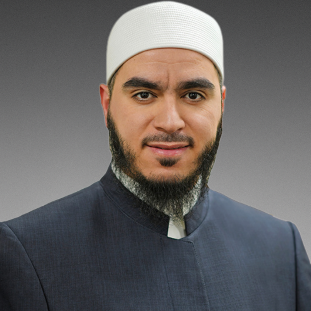 Bearded man wearing white kufi cap